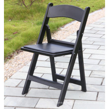 Chaise pliante rembourrée en vinyle noir